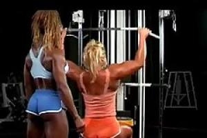 Two muscular females are very horny and having a nice sex affair  while in the gym