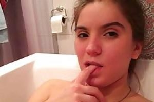 Small titted teen with perky nipples is having a bath in front of the camera