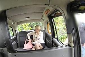 Voluptuous blonde with big tits is spreading her legs wide in the back of a taxi